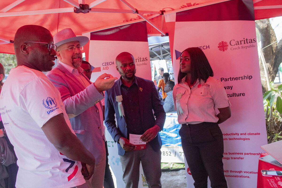 H.E Jiří Kyrian at the caritas exhibition stand being welcomed by the team H.E Jiří Kyrian at the caritas exhibition stand being welcomed by the team